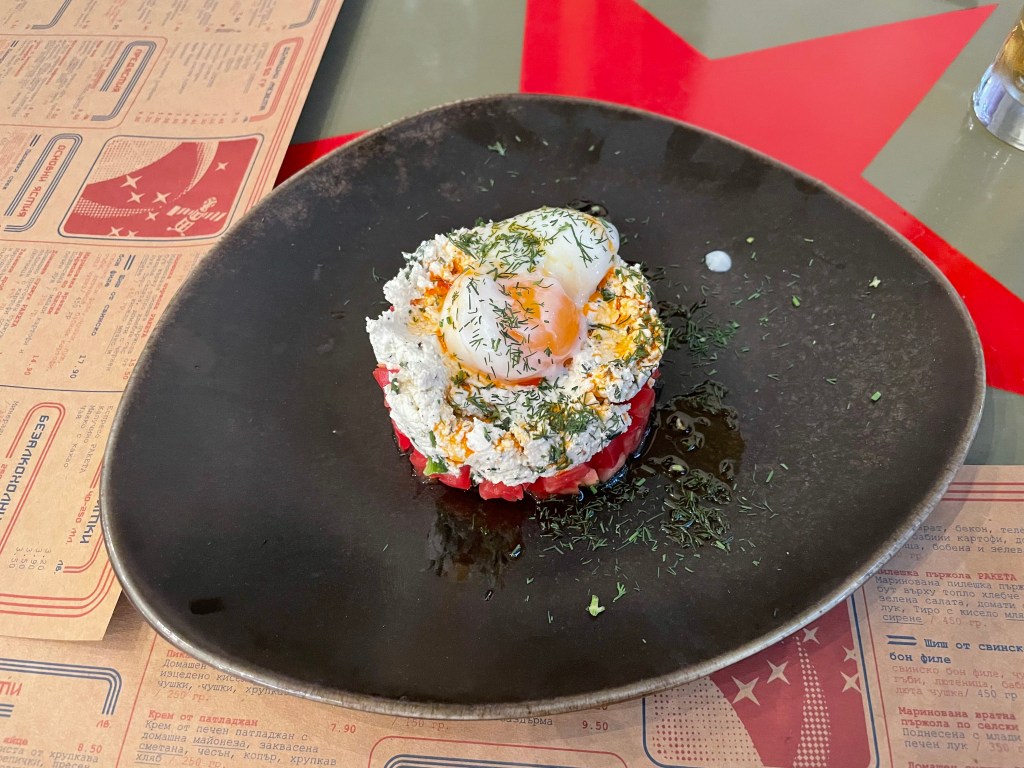 A salad, made of cheese, tomato and egg