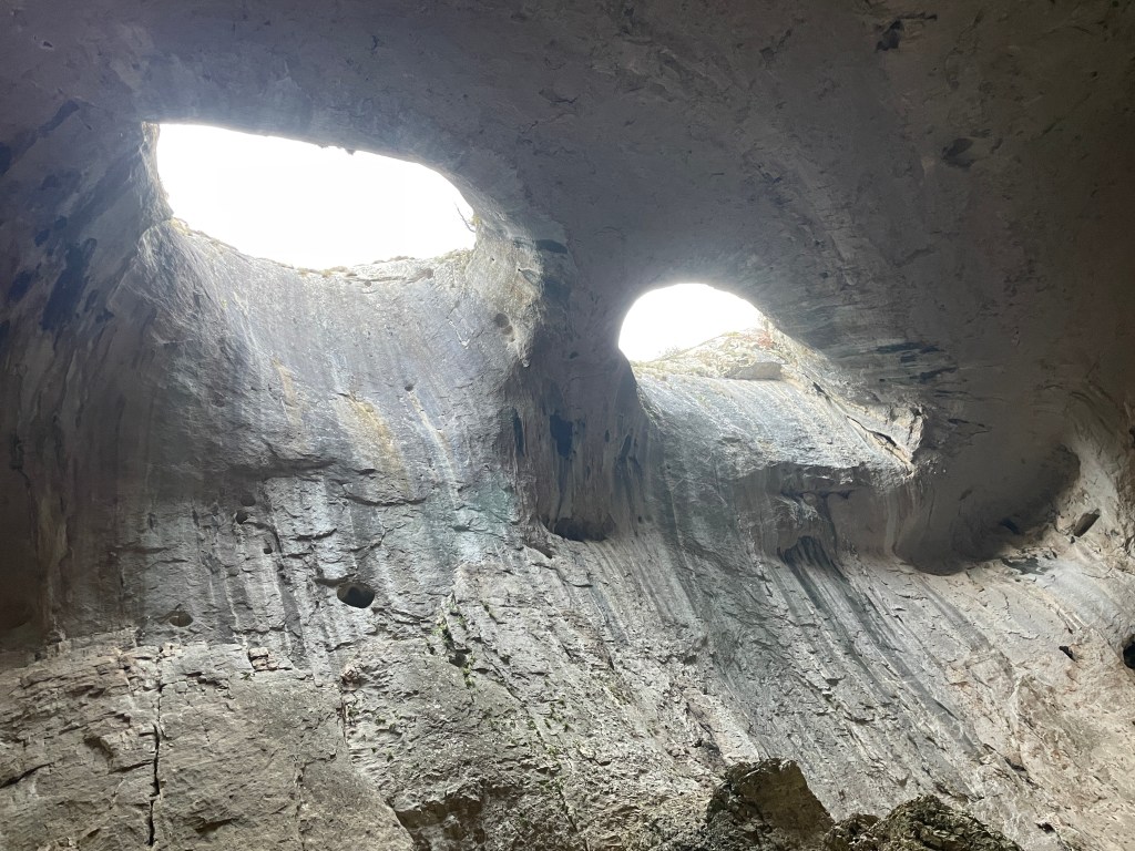 A picture of the cave Prohodna, representing the two holes that gave it the nickname The Eyes of God