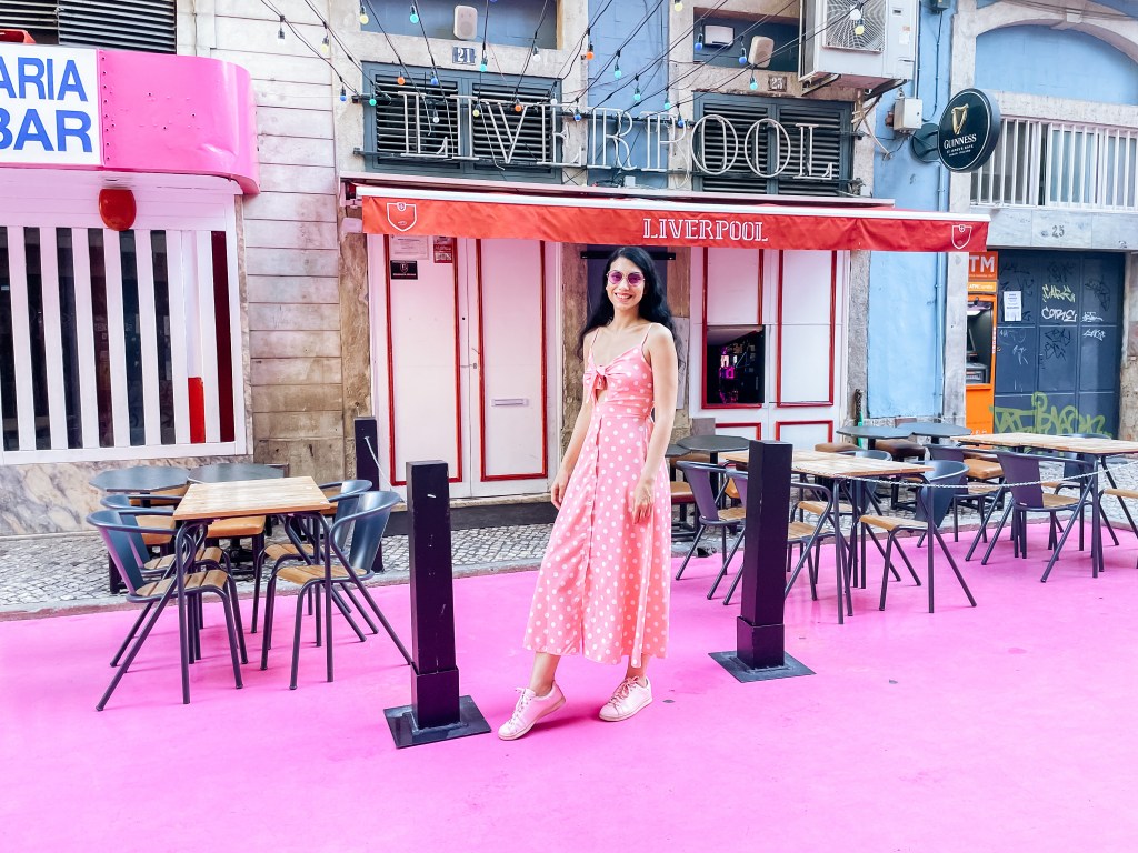 The author in a pink dress on the Pink Street