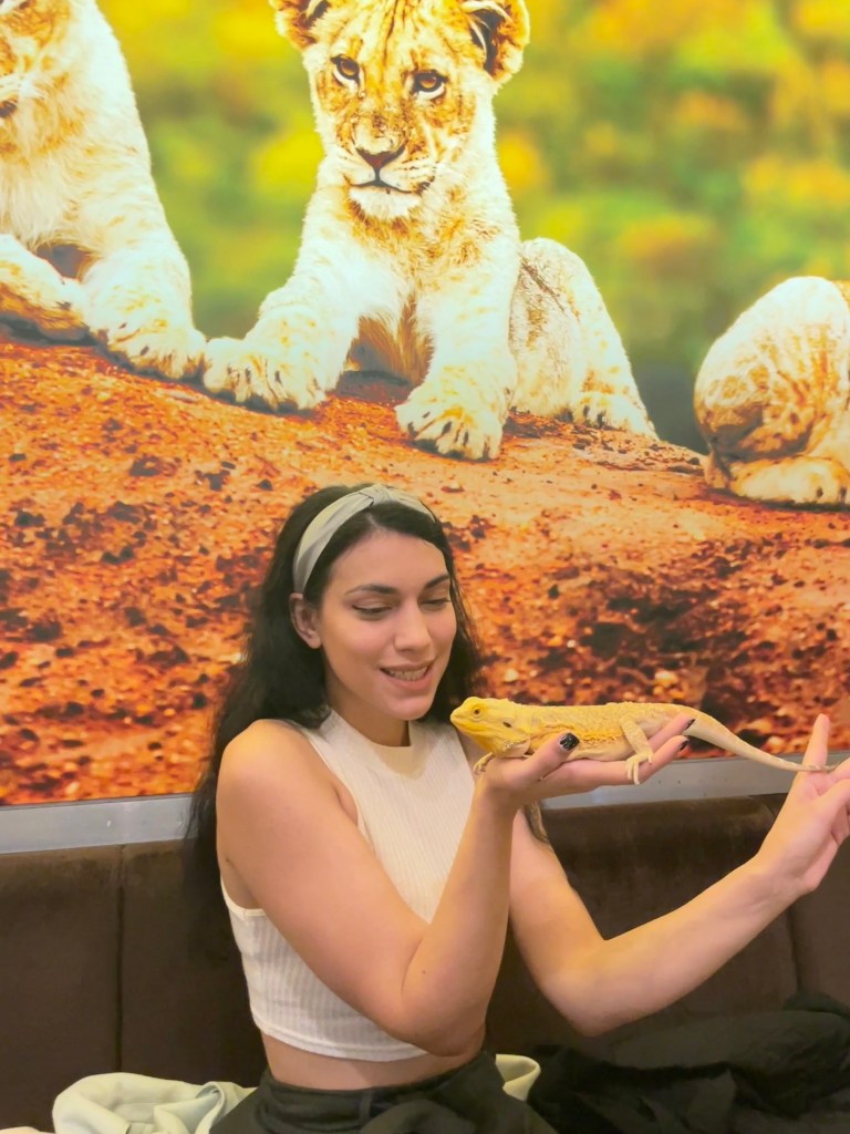 The author, holding a bearded dragon at Zoo Cafe